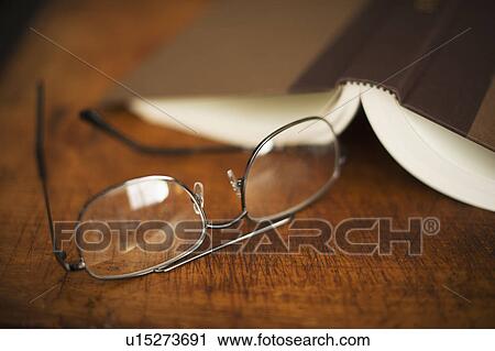 USA, New Jersey, Jersey City, Eyeglasses and open book View Large Photo Image Stock Image - USA, New Jersey, Jersey City, Eyeglasses and open book. Fotosearch