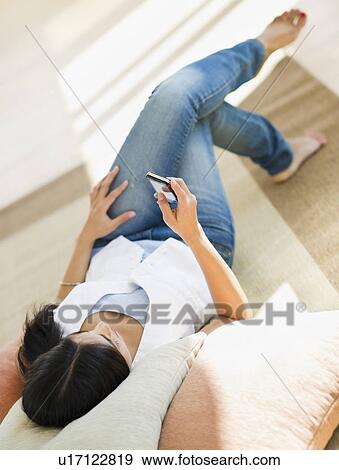 USA, New Jersey, Jersey City, Attractive young woman text-messaging View Large Photo Image Stock Photo - USA, New Jersey, Jersey City, Attractive young woman text-messaging. Fotosearch