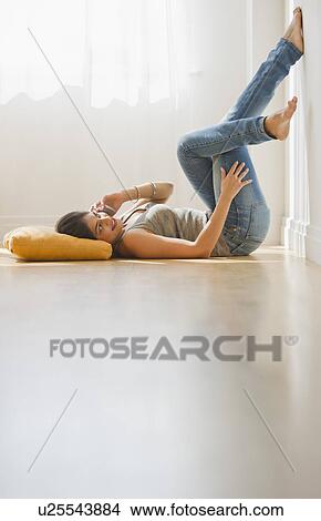 Picture - USA, New Jersey, Jersey City, Young attractive woman using mobile phone. Fotosearch