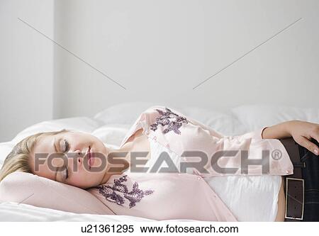 USA, New Jersey, Jersey City, Young attractive woman sleeping View Large Photo Image Stock Photography - USA, New Jersey, Jersey City, Young attractive woman sleeping. Fotosearch