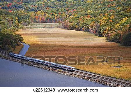 USA, New York, Bear Mountain, train going along lakeshore View Large Photo Image Stock Photo - USA, New York, Bear Mountain, train going along lakeshore. Fotosearch