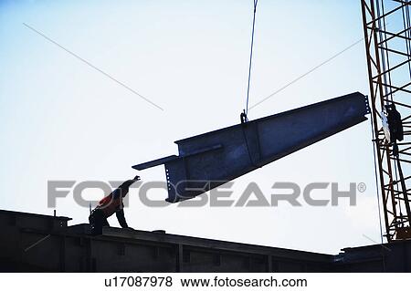 USA, New York City, girder being lifted at construction site View Large Photo Image Stock Photo - USA, New York City, girder being lifted at construction site. Fotosearch