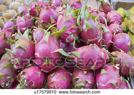 Stock Image - USA, New York City, heap of dragon fruit. Fotosearch