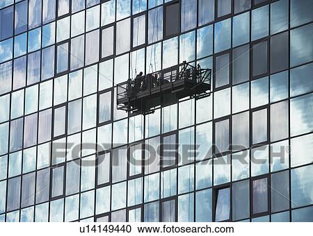 Stock Image - USA, New York City, Manhattan, window cleaning platform on building. Fotosearch