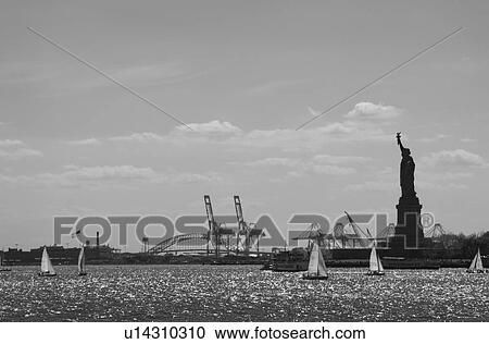 USA, New York City, sailboats and Statue of Liberty View Large Photo Image Stock Image - USA, New York City, sailboats and Statue of Liberty. Fotosearch
