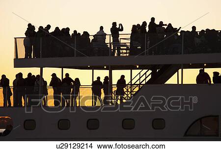 USA, New York City, Silhouette of passengers on tourboat View Large Photo Image Picture - USA, New York City, Silhouette of passengers on tourboat. Fotosearch