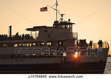 USA, New York City, Silhouette of passengers on tourboat View Large Photo Image Stock Photo - USA, New York City, Silhouette of passengers on tourboat. Fotosearch