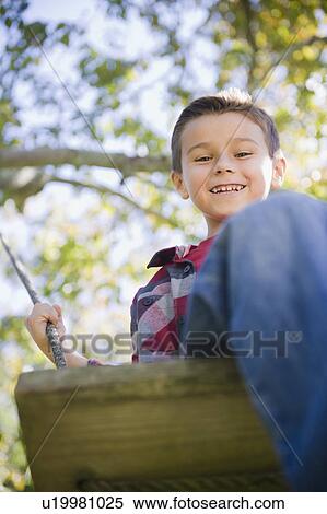 USA, New York, Flanders, Boy (8-9) playing in garden View Large Photo Image Stock Photography - USA, New York, Flanders, Boy (8-9) playing in garden. Fotosearch