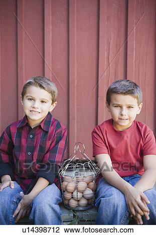 USA, New York, Flanders, Brothers (4-5, 8-9) posing with basket of eggs View Large Photo Image Stock Image - USA, New York, Flanders, Brothers (4-5, 8-9) posing with basket of eggs. Fotosearch