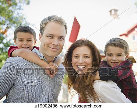 USA, New York, Flanders, Couple with two boys (4-5, 8-9) portrait View Large Photo Image Stock Photograph - USA, New York, Flanders, Couple with two boys (4-5, 8-9) portrait. Fotosearch