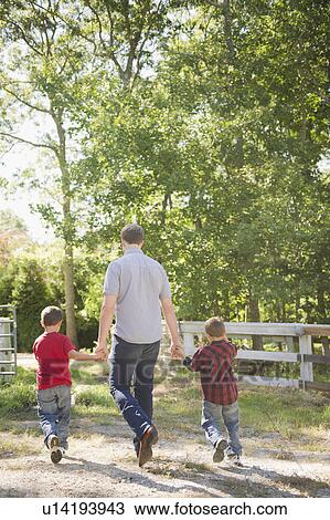 USA, New York, Flanders, Father with two sons (4-5, 8-9) walking in farm View Large Photo Image Stock Image - USA, New York, Flanders, Father with two sons (4-5, 8-9) walking in farm. Fotosearch