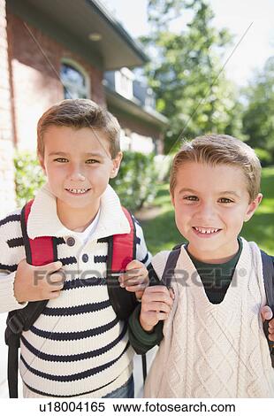 Stock Photography - USA, New York, Flanders, Portrait of two schoolboys (4-5, 8-9). Fotosearch