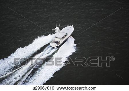 Stock Photograph - USA, New York, Long Island City, aerial view of speedboat. Fotosearch