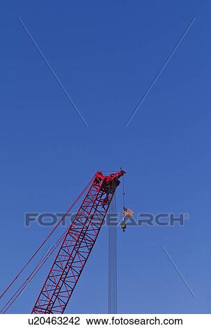 USA, New York, New York City, Construction crane with American flag View Large Photo Image Stock Image - USA, New York, New York City, Construction crane with American flag. Fotosearch