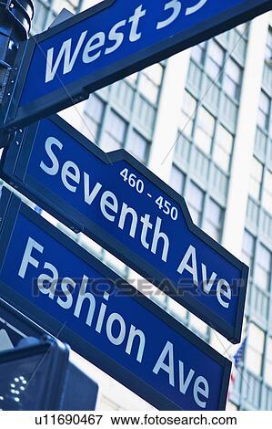 Stock Photo - USA, New York, New York City, Street sign for Fashion Avenue and Seventh Avenue in Manhattan. Fotosearch