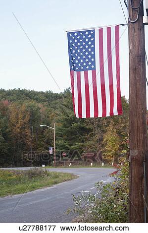 USA, New York State, Wurtsboro, American flag hanging on telephone pole View Large Photo Image Stock Photo - USA, New York State, Wurtsboro, American flag hanging on telephone pole. Fotosearch