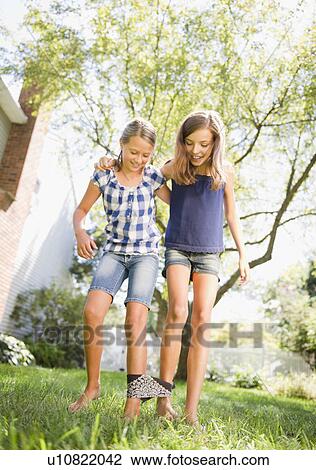 USA, New York, Two girls (10-11, 10-11) playing in backyard View Large Photo Image Stock Image - USA, New York, Two girls (10-11, 10-11) playing in backyard. Fotosearch