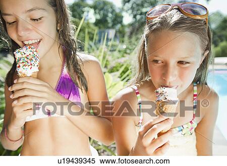 USA, New York, Two girls (10-11, 10-11) eating ice creams View Large Photo Image Stock Photography - USA, New York, Two girls (10-11, 10-11) eating ice creams. Fotosearch