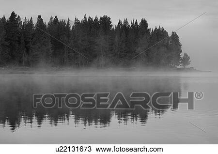 Stock Image - USA, Oregon, lake with fog. Fotosearch