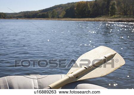 Stock Image - USA, Pennsylvania, Calicoon, Oar in kayak at lake. Fotosearch