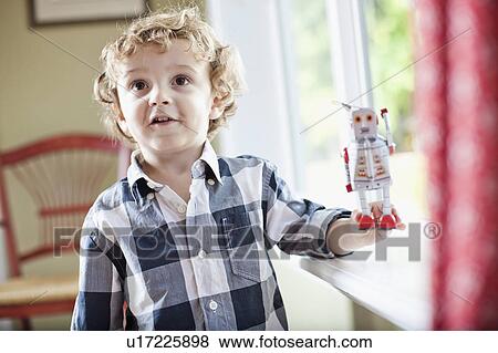 Stock Photo - USA, Utah, Boy (2-3) playing. Fotosearch