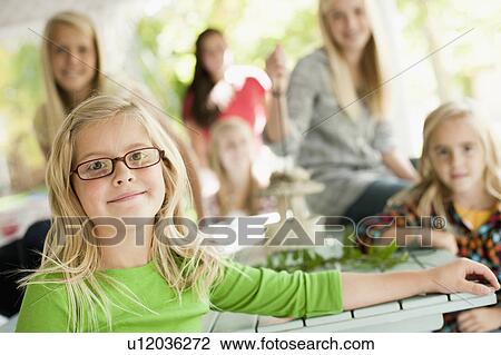 USA, Utah, family portrait of sisters (6-7, 8-9, 12-13, 14-15, 16-17) at table View Large Photo Image Stock Image - USA, Utah, family portrait of sisters (6-7, 8-9, 12-13, 14-15, 16-17) at table. Fotosearch