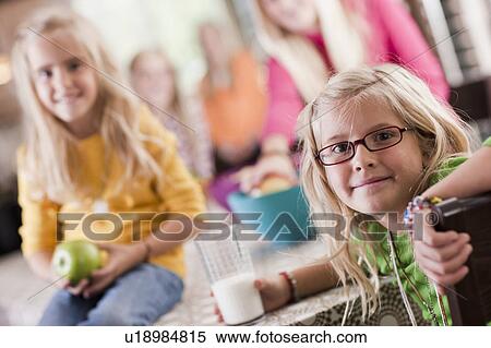 USA, Utah, family portrait of sisters (6-7, 8-9, 12-13, 14-15, 16-17) at table View Large Photo Image Stock Photography - USA, Utah, family portrait of sisters (6-7, 8-9, 12-13, 14-15, 16-17) at table. Fotosearch