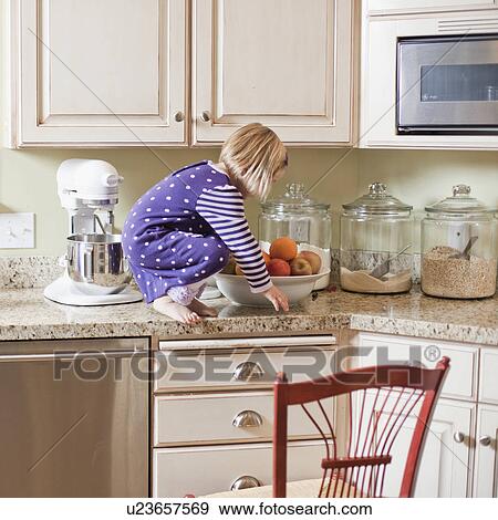 USA, Utah, Girl (2-3) climbing on cupboard in kitchen View Large Photo Image Stock Photo - USA, Utah, Girl (2-3) climbing on cupboard in kitchen. Fotosearch