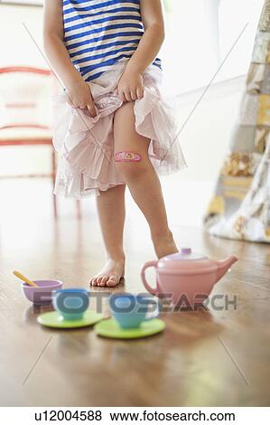 Stock Photo - USA, Utah, Girl (2-3) playing on floor. Fotosearch
