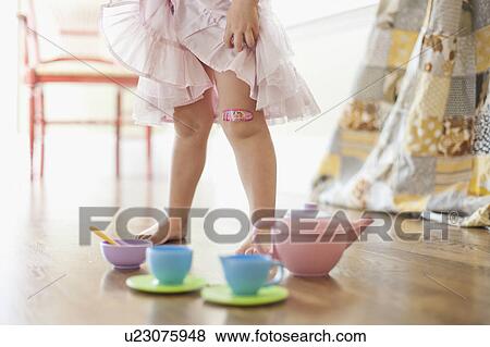 Stock Photo - USA, Utah, Girl (2-3) playing on floor. Fotosearch