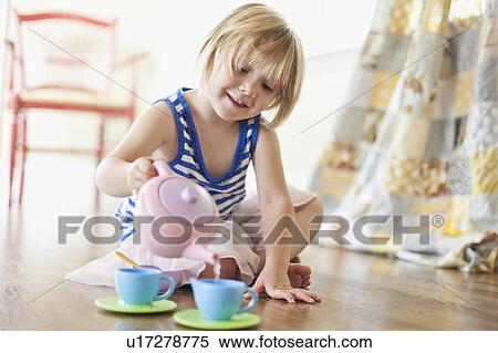 Stock Photography - USA, Utah, Girl (2-3) playing on floor. Fotosearch