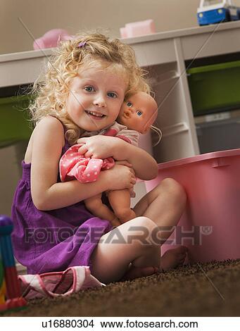 Picture - USA, Utah, Lehi, girl (2-3) hugging doll. Fotosearch