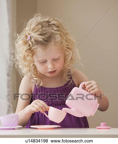 Stock Photo - USA, Utah, Lehi, girl (2-3) playing with toy crockery . Fotosearch