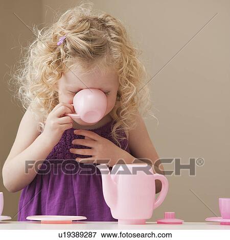 Stock Photo - USA, Utah, Lehi, girl (2-3) playing with toy crockery . Fotosearch