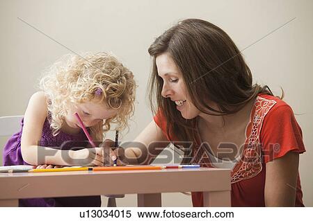 Stock Photography - USA, Utah, Lehi, mother and daughter (2-3) drawing together. Fotosearch