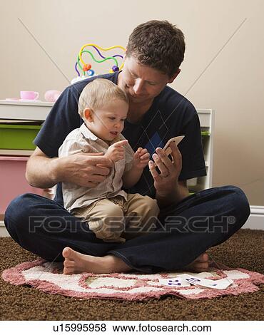 USA, Utah, playing with son (18-23 months) View Large Photo Image Stock Photo - USA, Utah, playing with son (18-23 months). Fotosearch