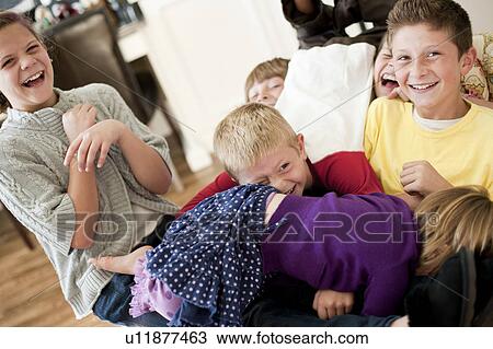 USA, Utah, Portrait of kids (2-3, 6-7, 10-11, 10-11) playing in living room View Large Photo Image Stock Image - USA, Utah, Portrait of kids (2-3, 6-7, 10-11, 10-11) playing in living room. Fotosearch
