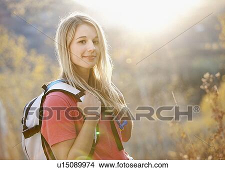 USA, Utah, portrait of young woman hiking in forest View Large Photo Image Picture - USA, Utah, portrait of young woman hiking in forest. Fotosearch
