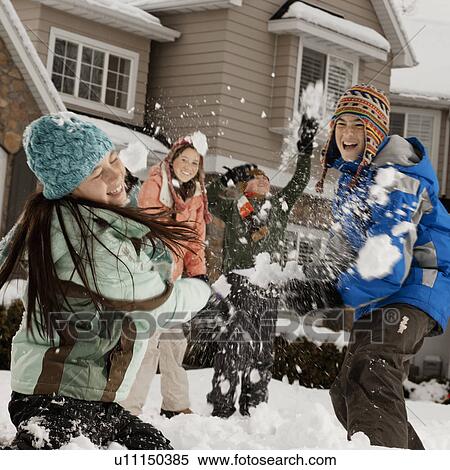 USA, Utah, Provo, Boys (10-11, 12-13) and girls (10-11, 16-17) having snow ball fight in front of house View Large Photo Image Stock Photography - USA, Utah, Provo, Boys (10-11, 12-13) and girls (10-11, 16-17) having snow ball fight in front of house. Fotosearch