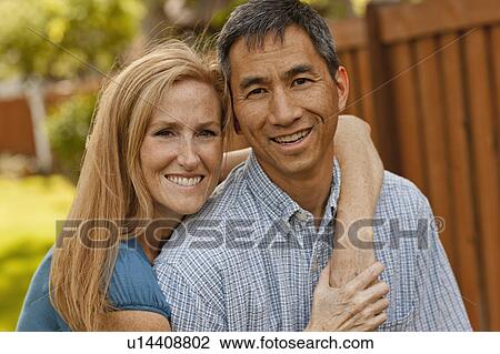 USA, Utah, Provo, Portrait of smiling mature couple in garden View Large Photo Image Stock Image - USA, Utah, Provo, Portrait of smiling mature couple in garden. Fotosearch