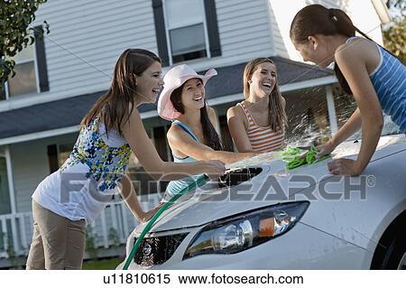 USA, Utah, Provo, Teenage girls (16-17) and young women watching car View Large Photo Image Stock Photography - USA, Utah, Provo, Teenage girls (16-17) and young women watching car. Fotosearch