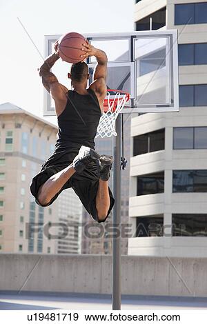 USA, Utah, Salt Lake City, man playing basketball View Large Photo Image Stock Photo - USA, Utah, Salt Lake City, man playing basketball. Fotosearch