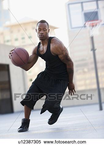 USA, Utah, Salt Lake City, young man playing basketball View Large Photo Image Stock Photography - USA, Utah, Salt Lake City, young man playing basketball. Fotosearch