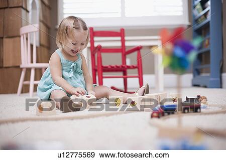USA, Utah, small girl (2-3) playing on floor View Large Photo Image Stock Photo - USA, Utah, small girl (2-3) playing on floor. Fotosearch