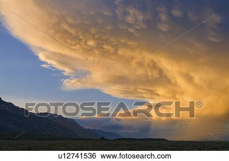 USA, Wyoming, Storm clouds over plains at sunset View Large Photo Image Stock Photograph - USA, Wyoming, Storm clouds over plains at sunset. Fotosearch