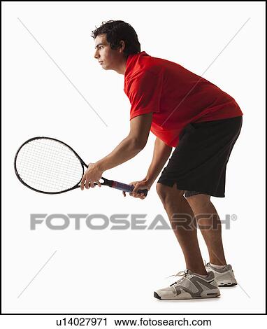 Young man playing tennis View Large Photo Image Stock Image - Young man playing tennis. Fotosearch