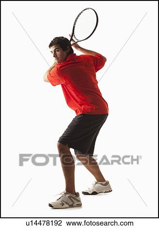 Young man playing tennis View Large Photo Image Stock Image - Young man playing tennis. Fotosearch