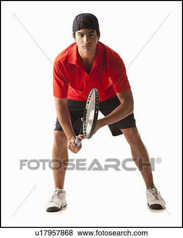 Stock Photo - Young man playing tennis. Fotosearch
