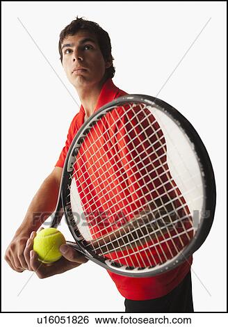 Stock Photograph - Young man playing tennis. Fotosearch