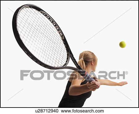 Young woman playing tennis View Large Photo Image Stock Image - Young woman playing tennis. Fotosearch